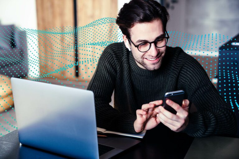 Mid aged man working on laptop computer from home